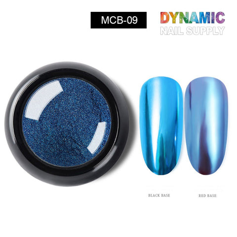 A round black jar contains the Metallic Chrome Pigment for Nail Design in the shade MCB-09 blue. Nearby, two swatches showcase its chrome effect: applied over a black base, it shines with a dark metallic blue finish; on a red base, it reveals a vibrant iridescent sheen. This product is perfect for enhancing any nail art design and is proudly offered by Dynamic Nail Supply.