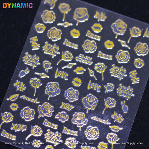The hand writing art (gold) nail decals from the CB 200 collection by Dynamic Nail Supply showcase intricate designs set against a black background, including elements such as roses, lips, and words like Love, XOXO, Rosa, and Amour.