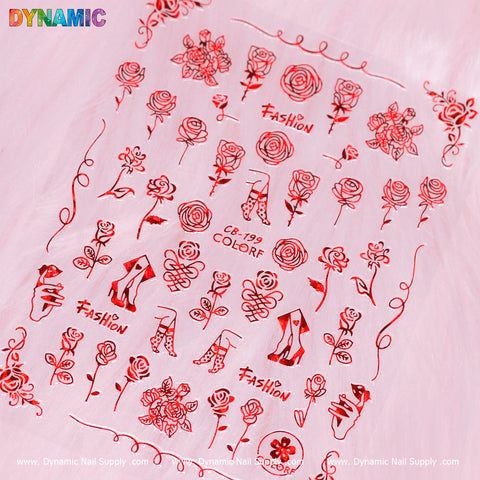 Positioned against a pink fuzzy backdrop, the decorative nail art sheet from Dynamic Nail Supply is accentuated with red designs of roses and high heels, featuring intricate hand writing art. The word "Fashion" graces the sheet, which presents floral motifs and shoe illustrations in a grid pattern. This unique style is identified as CB 199.