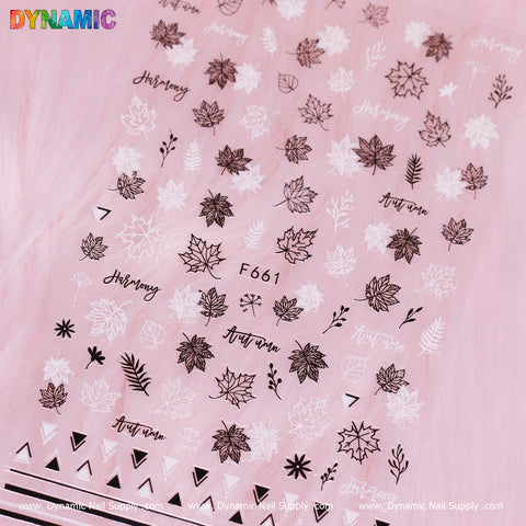 The sheet of nail art stickers on a pink background features autumn-themed designs, including detailed black and white outlines of fall leaves, with the word "Autumn" elegantly scripted in cursive. It prominently displays the code F 661 from Dynamic Nail Supply's collection of "fall leaves (black and white).