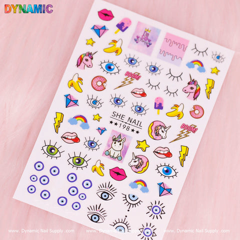 A sheet of eye-catching nail stickers on a pink background features designs like unicorns, devil eyes, lips, lightning bolts, bananas, popsicles, and geometric shapes. The word "Dynamic" adorns the top left corner while "Dynamic Nail Supply" is elegantly printed along the bottom edge.