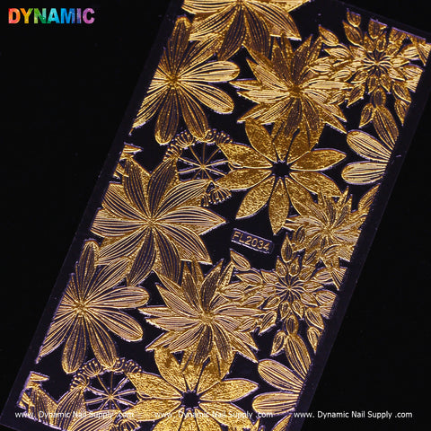 A black rectangular nail art stamping plate called "Gold Flowers (FL 2034)" from Dynamic Nail Supply, featuring gold floral patterns of varying flower sizes with intricate petals and leaves. The code FL2034 is engraved in the center, while the brand name Dynamic Nail Supply stands out vibrantly at the top left.