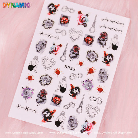 A sheet of Dynamic Nail Supply's Halloween Sticker (B093) nail art is showcased on a pink fuzzy background, featuring designs like skulls, red and purple roses, infinity symbols, broken heart chains, nooses, and silhouettes of sitting figures. Some stickers also include splashes of red and black for an added edgy touch.