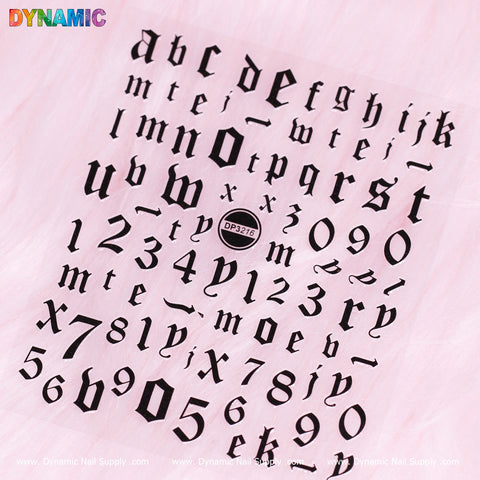 A sticker sheet from Dynamic Nail Supply showcases black Gothic-style letters and numbers set against a pale pink background. The lowercase alphabet and digits from 0 to 9 are enhanced with the word "DYNAMIC" in rainbow colors positioned at the top left. Centrally placed is a circular label featuring the product code DP3216, making it an ideal choice for all your letter and number sticker requirements.