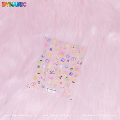 The Colorful Kid Hand Drawing Sticker (TS-1249) from Dynamic Nail Supply showcases an array of adorable designs, including animals, hearts, stars, and faces on a soft pink fluffy background. The vibrant and pastel hues are eye-catching, while the DYNAMIC logo adorns the top left corner.