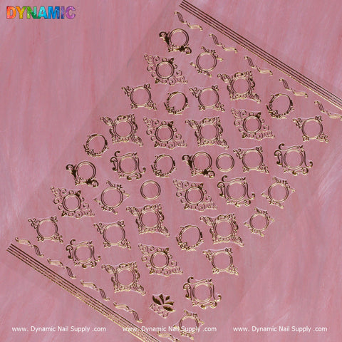 A sheet of Mirror Style Sticker (R350) in a mirror-style gold finish is displayed against a pink background. The intricate designs, featuring circular frames and abstract shapes, are neatly organized in a grid pattern. At the bottom edge, 'Dynamic Nail Supply' is prominently printed in clean white text.