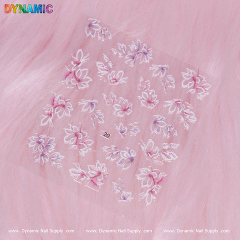 A Flower Sticker (20) featuring elegant decals of white and pink blossoms is set against a soft pink fur background, with Dynamic Nail Supply's brand prominently displayed along the bottom edge.