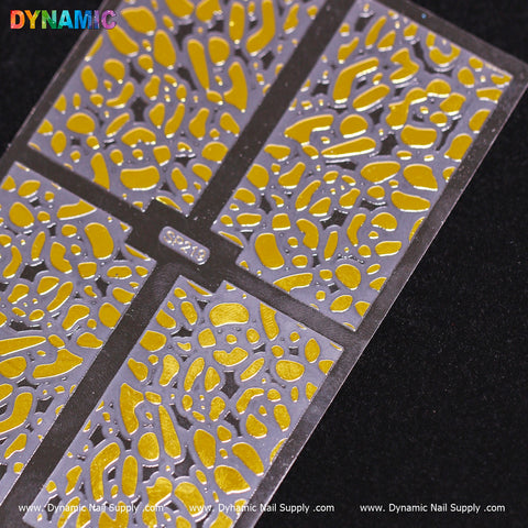 A close-up of the Animal Pattern Nail Sticker (SP219) reveals an intricate, abstract animal print design with irregular yellow shapes on a metallic silver background. The brand name, Dynamic Nail Supply, is prominently displayed at the top in colorful letters.
