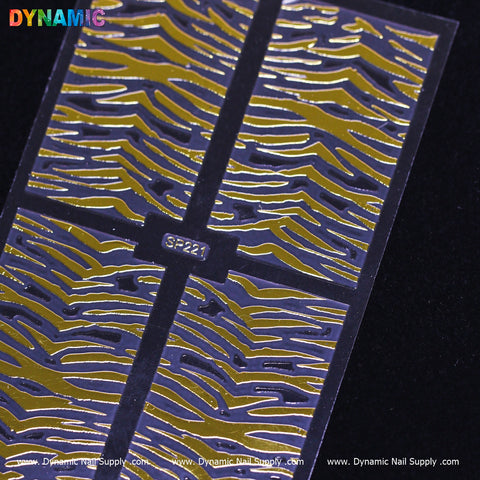 The Animal Pattern Nail Sticker (SP221) from Dynamic Nail Supply features tiger stripes in bold gold and black. The word DYNAMIC appears in vibrant letters at the top left corner, accompanied by a website URL at the bottom for exploring more nail sticker designs.