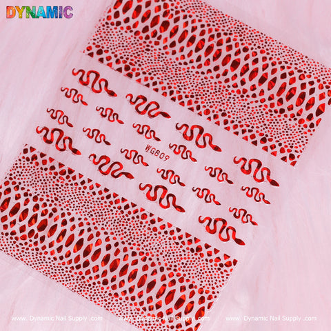 Displayed against a pink textured background, the Snake Skin Nail Water Decal (WG809) - Red showcases intricate red and black snake skin patterns. The bottom edge features the brand name Dynamic Nail Supply, adding an elegant touch to your nail art experience.