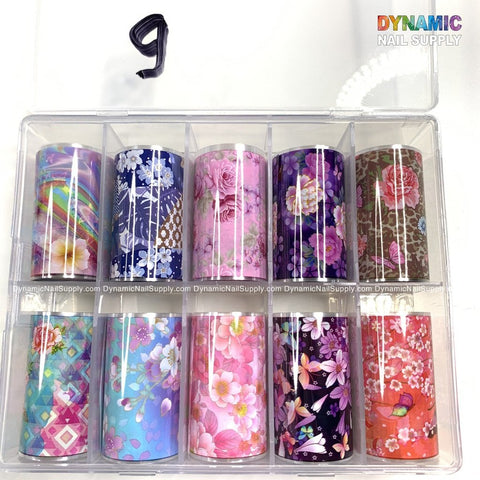 The Nails Art Design Foils - 9 by Dynamic Nail Supply feature a transparent plastic case containing ten vibrant design foils, ideal for nail art lovers. Each section highlights unique designs such as floral patterns, geometric shapes, and nature-themed motifs. A black number 9 is prominently displayed on the top left corner of the case.