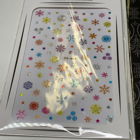 Dynamic Nail Supply offers a festive bundle of 20pcs Christmas nail stickers for $30, featuring snowflakes in vibrant pink, blue, orange, and silver hues. Designed like the ZS-003 sheet, each set includes varying sizes and designs with charming star and dot accents, all neatly encased in clear packaging for easy access.