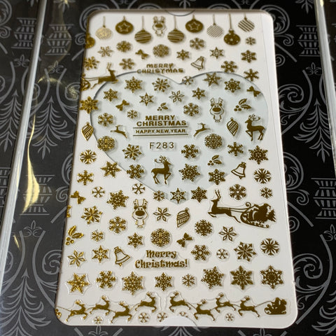 Introducing the Dynamic Nail Supply's Bundle of 20pcs Christmas Nail Stickers for $30, featuring an array of gold designs on a pristine white background. The collection includes festive motifs such as snowflakes, reindeer, ornaments, and Santa in his sleigh. The texts "Merry Christmas" and "Happy New Year" add a cheerful touch, with the code F283 elegantly displayed at the center.