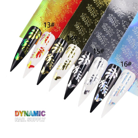 The "Hot Design 16pcs/set - Holographic Leaves Sticker for Nail Art Decoration" from Dynamic Nail Supply showcases stunning long nail designs with metallic leaf and holographic leaf patterns in gold, silver, and rainbow shades. These designs can be applied to various backgrounds like black, white, and red. Each style is uniquely labeled from #13 to #16, and the multicolored Dynamic Nail Supply logo adorns the bottom left corner. Perfect for enhancing your nail art decoration!