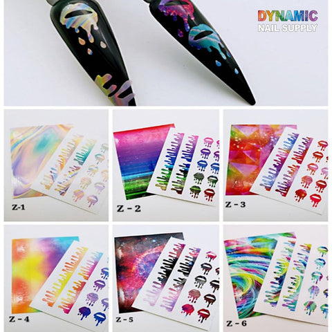Image featuring the Hot Designs - Lips Sticker for Nails Art Decoration from Dynamic Nail Supply. At the top, there are two black nail tips embellished with vibrant drip designs. Below, you'll find six sets labeled Z-1 to Z-6, each showcasing an array of colorful, abstract, and galaxy-inspired stickers ideal for nail decoration.