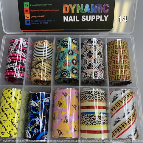Introducing the Nail Art Design Foils - 14 by Dynamic Nail Supply: a set of ten decorative foils stored in a transparent container, ideal for nail art enthusiasts. Each foil features distinct designs, including logos, geometric patterns, stripes, and animal prints. The packaging includes a card with contact information and a Houston address from Dynamic Nail Supply.