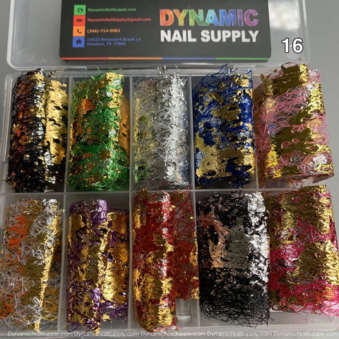 A transparent container from Dynamic Nail Supply, featuring their Nail Art Design Foils - 16, includes metallic foils in gold, silver, red, blue, and green for creating beautiful nail designs. Each section houses a roll of design foil. The lid showcases Dynamic Nail Supply's contact details and the number 16 is positioned in the top right corner.