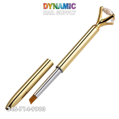 The Nail Art Pen Brush Metal Crystal Replace Heads Flat Line Flower Drawing Painting Manicure Tool is an essential addition to any manicure set. Its gleaming gold design features a detachable cap and a handle adorned with a large clear gemstone. The brand name "Dynamic Nail Supply" is prominently displayed above, with the phone number 346-714-9983 elegantly placed in white on the bottom left against a pristine backdrop.