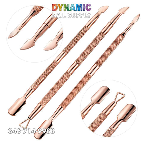 Dual-ended Rose Gold Nail Art Cuticle Pushers and Manicure Pedicure Stainless Steel tools are displayed against a white background, featuring angled tips and textured handles for enhanced grip. A close-up inset in the top left corner emphasizes the tool ends. Discover the elegance of Dynamic Nail Supply's Rose Gold collection. Call 346-714-9983 for more details.