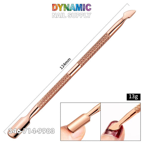 A detailed view of the Dual-ended Rose Gold Nail Art Cuticle Pusher crafted from stainless steel by Dynamic Nail Supply showcases its dual design and textured grip. This manicure and pedicure tool measures 124mm and weighs 13g. Additional images depict its application on nails, with the Dynamic Nail Supply logo and contact number displayed above.