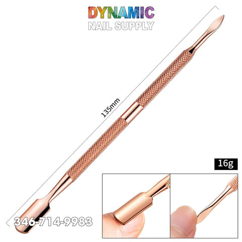 This dual-ended rose gold nail art cuticle pusher, crafted from 135mm stainless steel, offers a textured grip for effortless handling. It features detailed insets showcasing its curved and pointed ends. Weighing only 16g, this manicure and pedicure tool prominently displays Dynamic Nail Supply's contact details in vibrant text at the top.