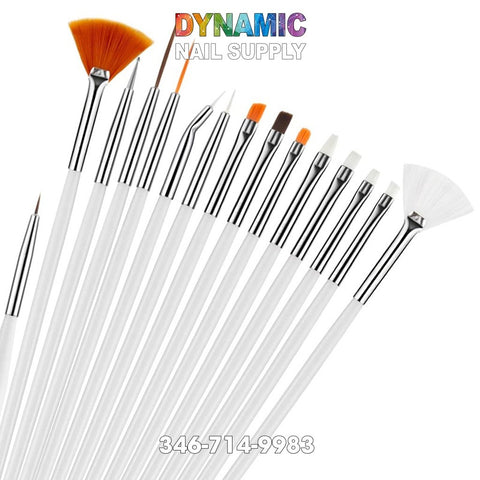 A collection of 15 nail art brushes, ideal for liner painting, featuring white handles and silver ferrules arranged in a fan shape. This set includes various shapes and sizes such as thin liners, fans, and angled tips. "Dynamic Nail Supply" is displayed in colorful text above the brushes alongside the contact number 346-714-9983.