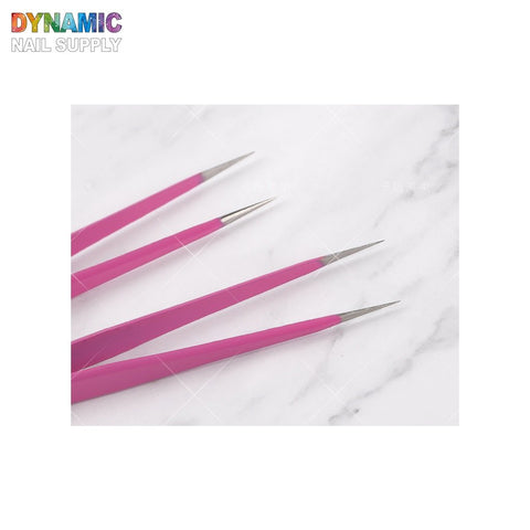 Four pink-handled, double-headed nail art tweezers designed for various manicure and nail design purposes are arranged in a fan-like pattern on a white marble background. The image features the Dynamic Nail Supply logo in the top left corner.