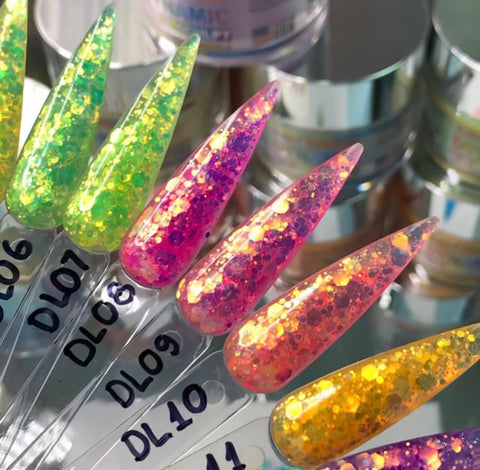 Close-up of vibrant glittery nail samples, crafted with the New Neon Glitter Acrylic Collection for the Summer 2021 by Dynamic Nail Supply, designed for long-lasting wear. Displayed in elongated shapes on a transparent stand, they are marked DL06 to DL11 and showcase a color range from lime green to deep pink and orange, each embedded with multicolored sparkling glitter. In the background, blurred jars of nail products can be seen.