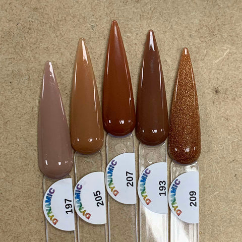 Five nail polish swatches on clear sticks labeled with the shades 197 light taupe, 205 tan, 207 medium brown, 193 darker brown, and 209 sparkly copper. Each swatch from the "2024 New Fall Colors Acrylic Collection (Part 1) - Brown Shades for Fall Season" by Dynamic Nail Supply features a chip-resistant glossy finish. The labels showcase a vibrant DYNAMIC logo against a textured beige background.