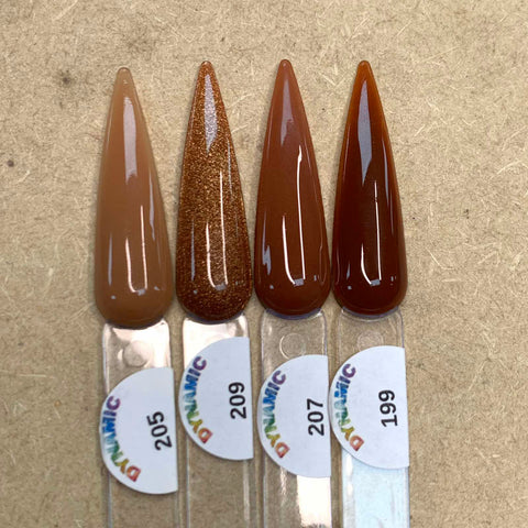 Four samples from the 2024 New Fall Colors Acrylic Collection by Dynamic Nail Supply, featuring teardrop shapes, are arranged vertically on a textured beige surface—ideal for creative nail art. The swatches showcase the shades taupe (205), glittery bronze (209), burnt sienna (207), and rich brown (199). Each chip-resistant color is displayed on a clear plastic strip adorned with a vibrant DYNAMIC sticker.