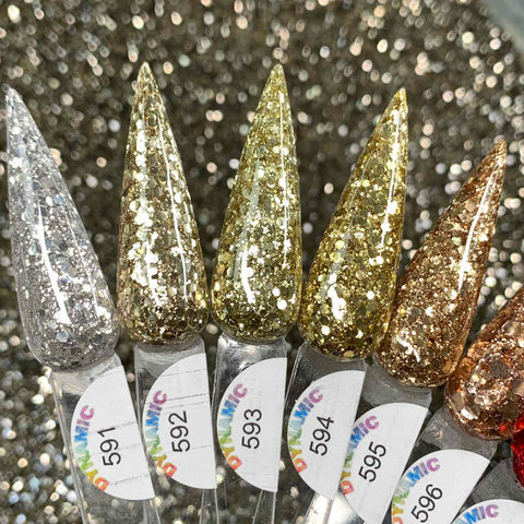 Five transparent swatches from the "Holiday Sparkle" Acrylic Powder Collection by Dynamic Nail Supply are displayed, each labeled consecutively from numbers 591 to 595. The glitter colors transition from silver to gold with progressively darker shades. A sparkling background accentuates the shimmering swatches, making them ideal for Christmas 2024 celebrations.