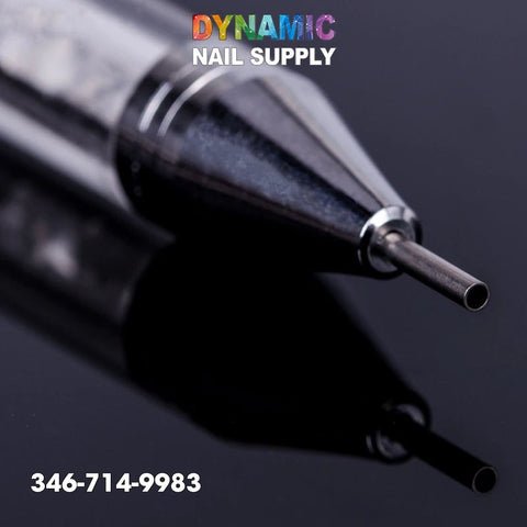 Close-up of a Dual-ended Nail Art Wax Dotting Pen Picking Up Rhinestone against a glossy black background, ideal for intricate nail art. The tip is sharp and reflective. Text at the top reads Dynamic Nail Supply in colorful letters. A phone number, 346-714-9983, is displayed in white at the bottom left corner.